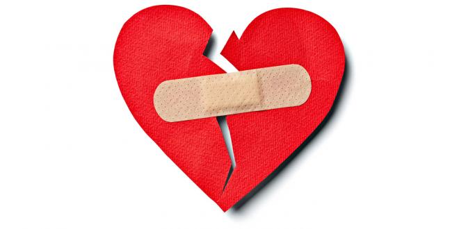 A paper heart held together by a band-aid